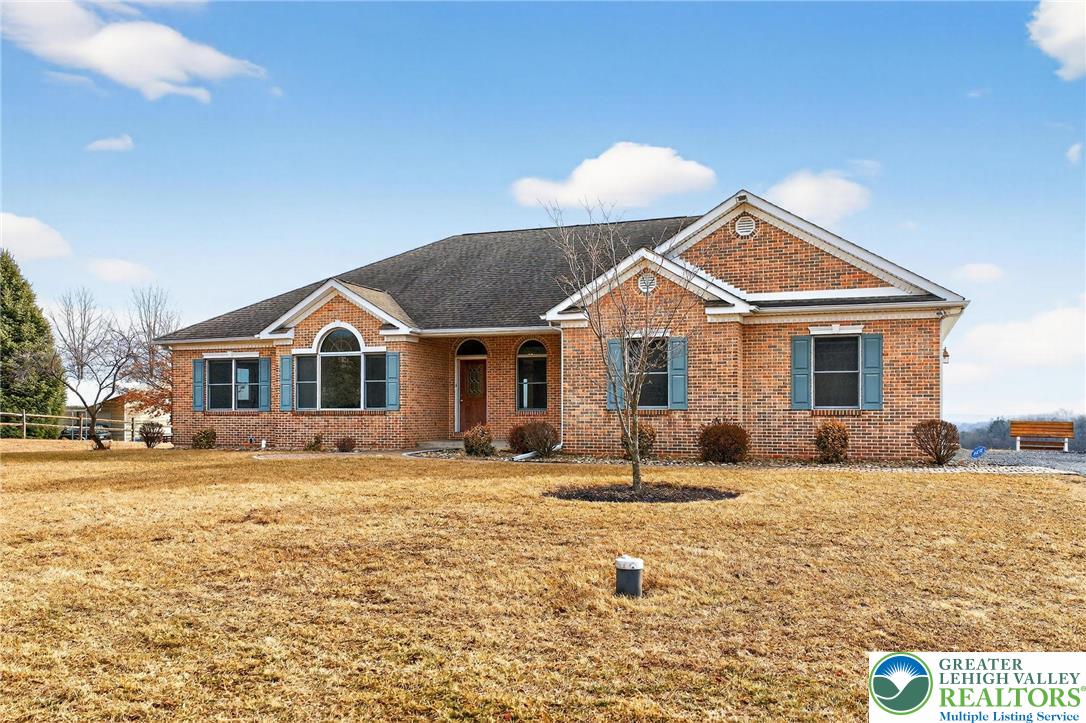 3338 Spring Valley Road Slatington, PA 18080 - Photo 1 of 53 a front view of a house with a yard
