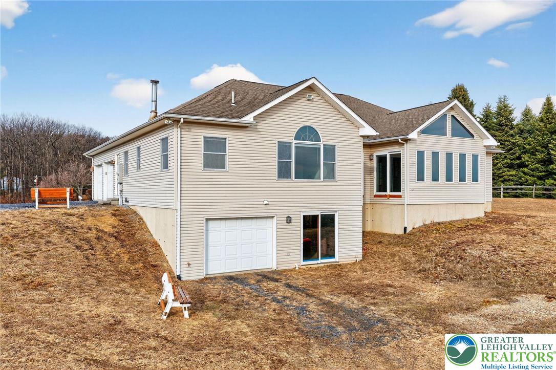 3338 Spring Valley Road Slatington, PA 18080 - Photo 12 of 53 a view of a white house with large windows