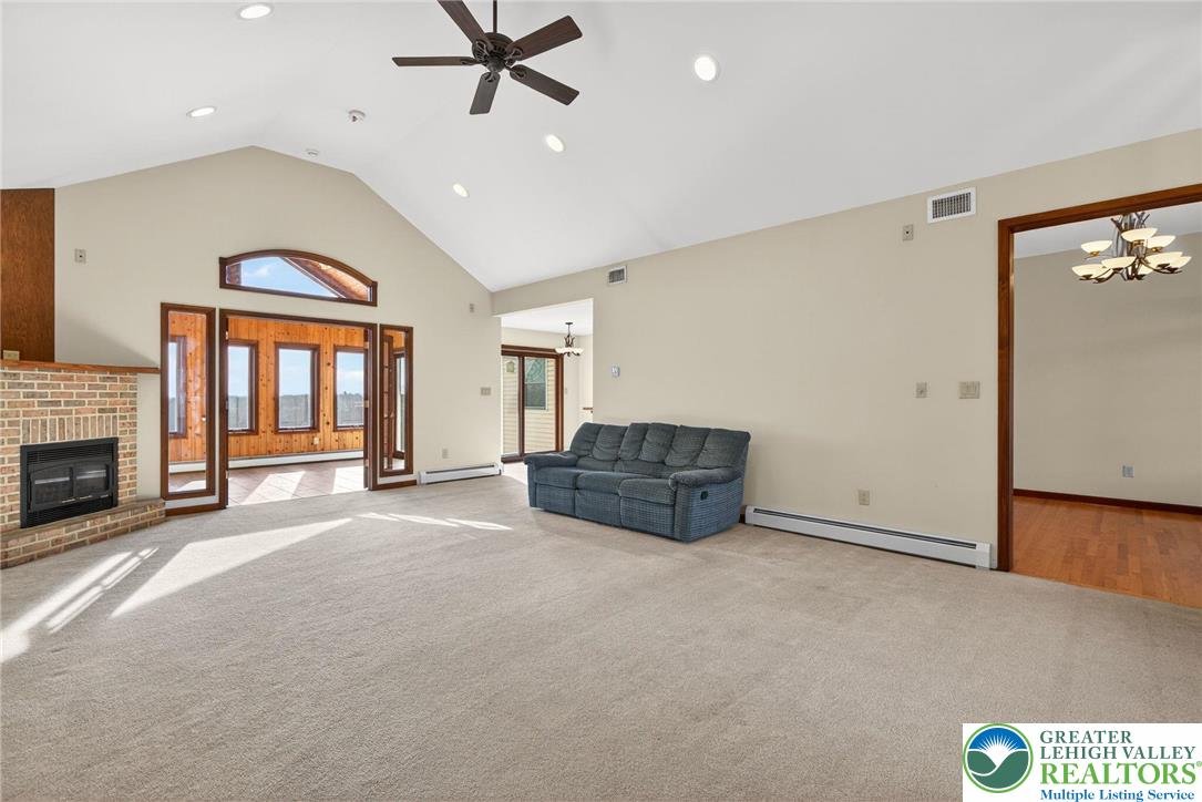 3338 Spring Valley Road Slatington, PA 18080 - Photo 14 of 53 a living room with furniture and a fireplace