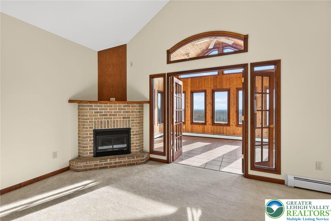 3338 Spring Valley Road Slatington, PA 18080 - Photo 15 of 53 a view of an empty room with a fireplace and a window