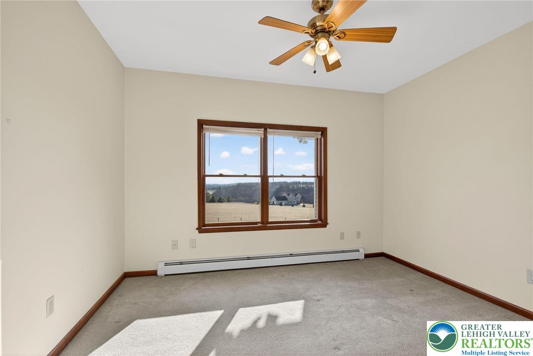 3338 Spring Valley Road Slatington, PA 18080 - Photo 41 of 53 an empty room with windows and fan