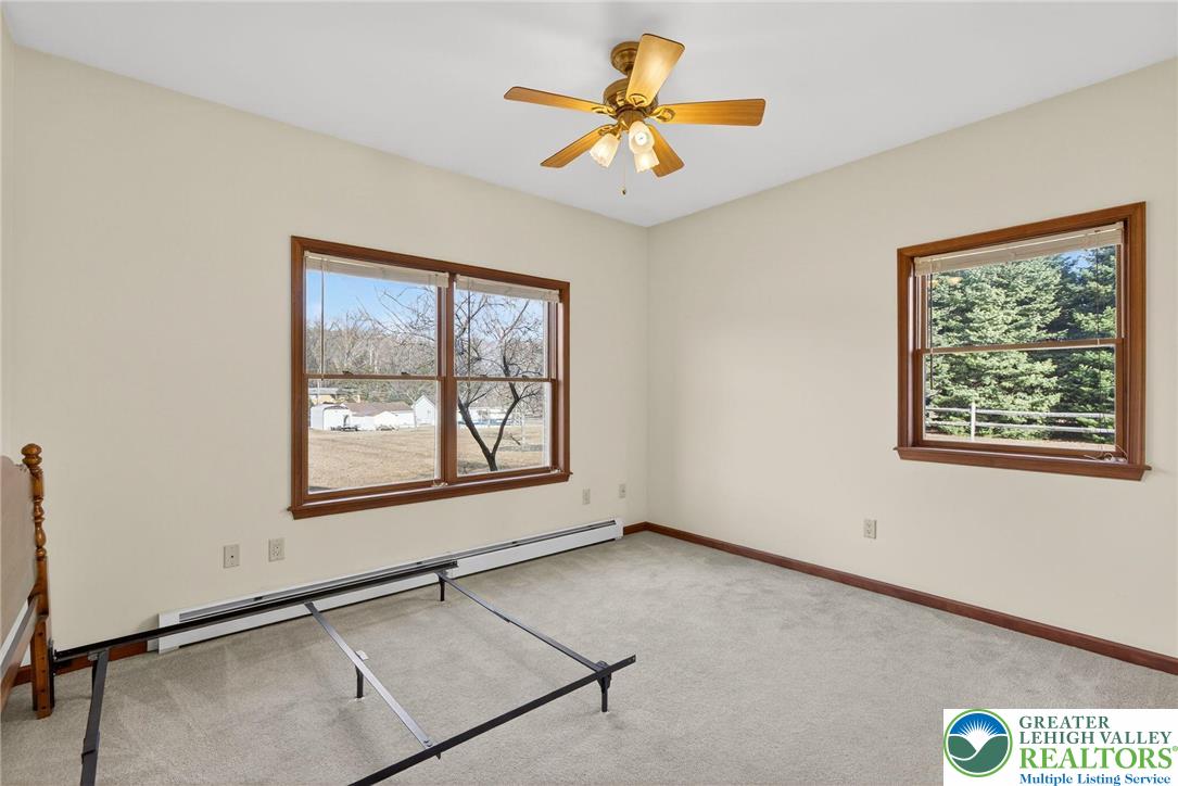 3338 Spring Valley Road Slatington, PA 18080 - Photo 42 of 53 an empty room with windows and fan