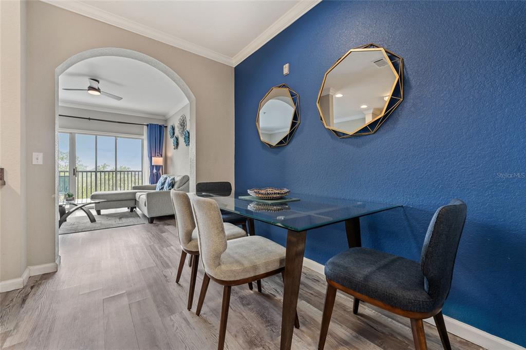 14200 Avalon Road, Unit 409 Winter Garden, FL 34787 - Photo 10 of 33 a view of a dining room with furniture and a mirror
