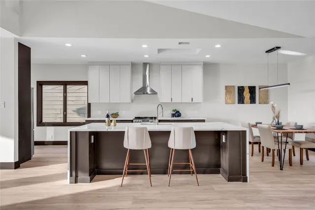 a kitchen with a table and chairs in it