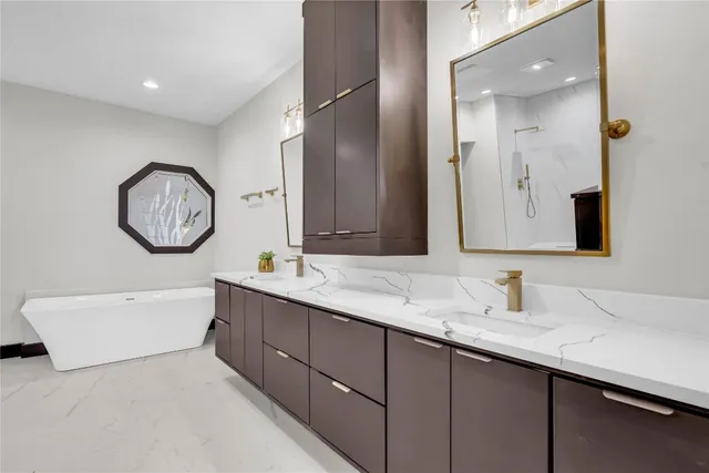 a bathroom with a double vanity sink and a mirror