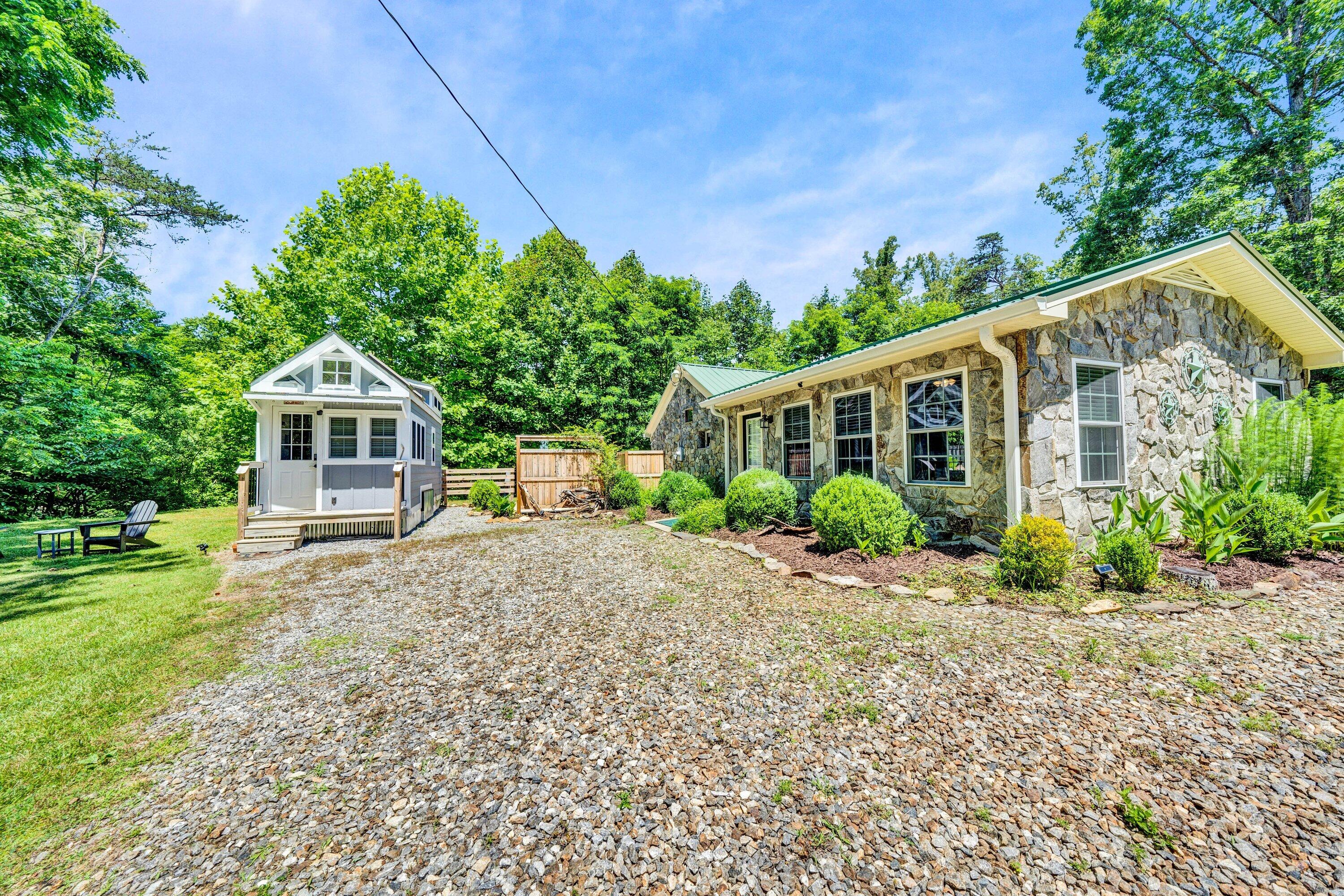 670 Twin Ridge Marina Road Henry, VA 24102 - Photo 1 of 87 a front view of a house with a garden