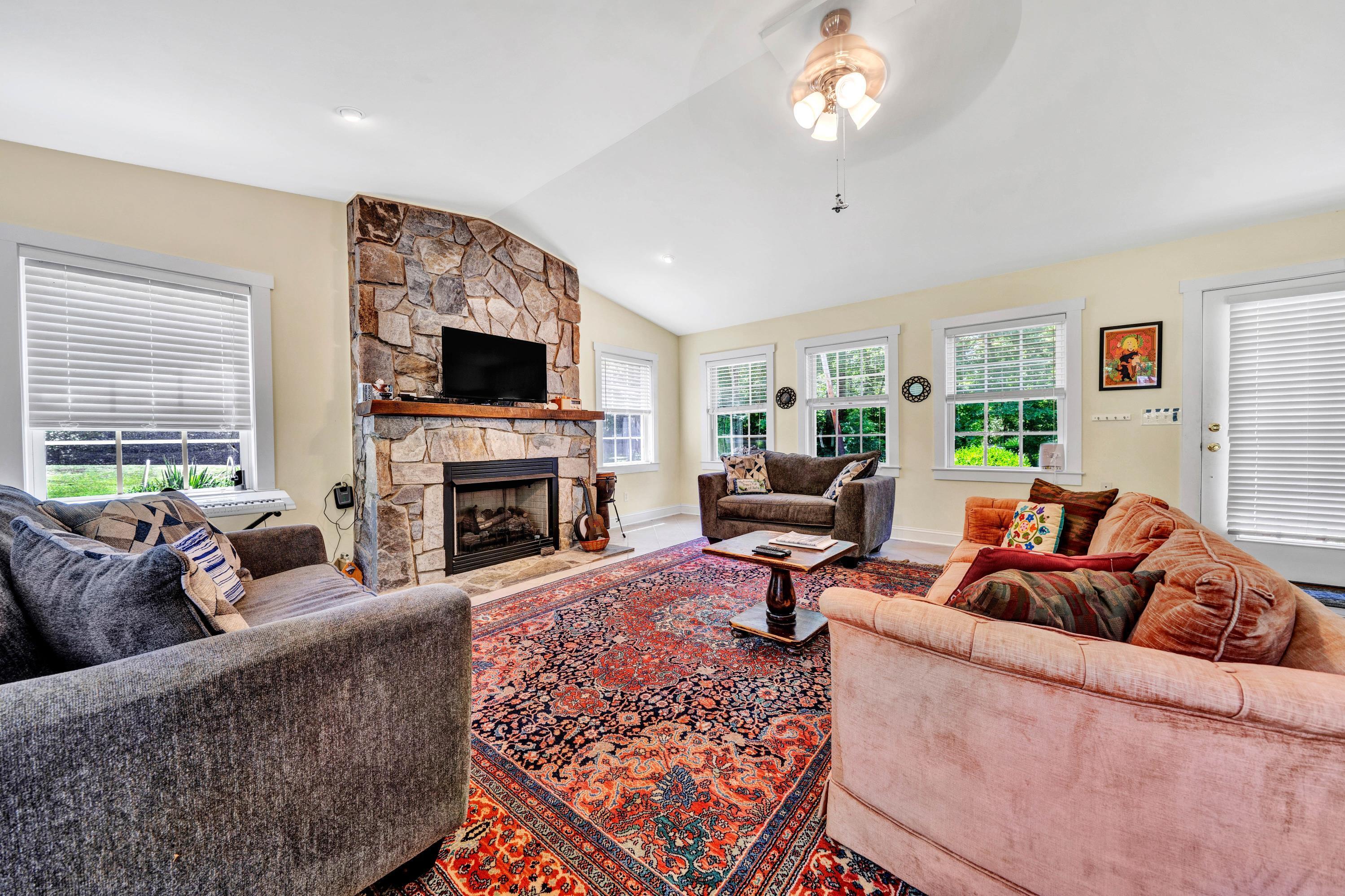 670 Twin Ridge Marina Road Henry, VA 24102 - Photo 13 of 87 a living room with furniture a fireplace and a flat screen tv