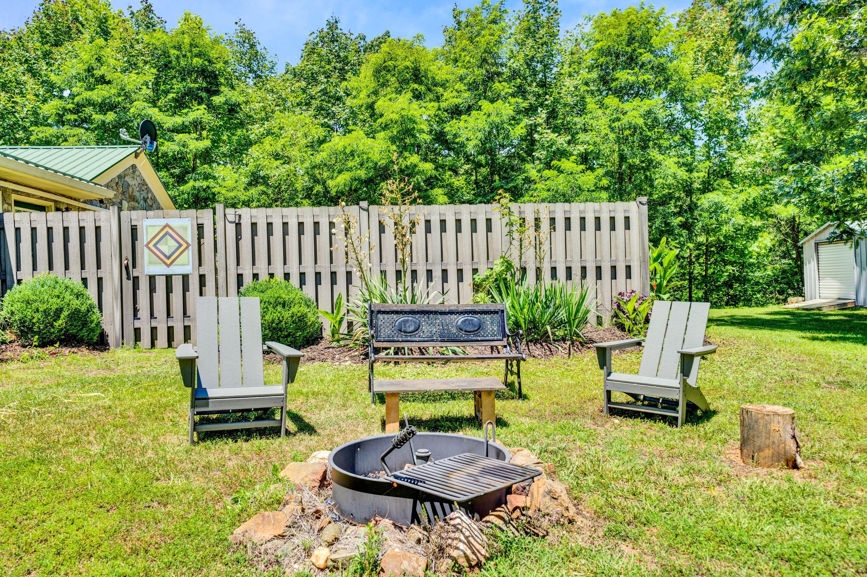 670 Twin Ridge Marina Road Henry, VA 24102 - Photo 25 of 87 a view of a chair and table in backyard of the house
