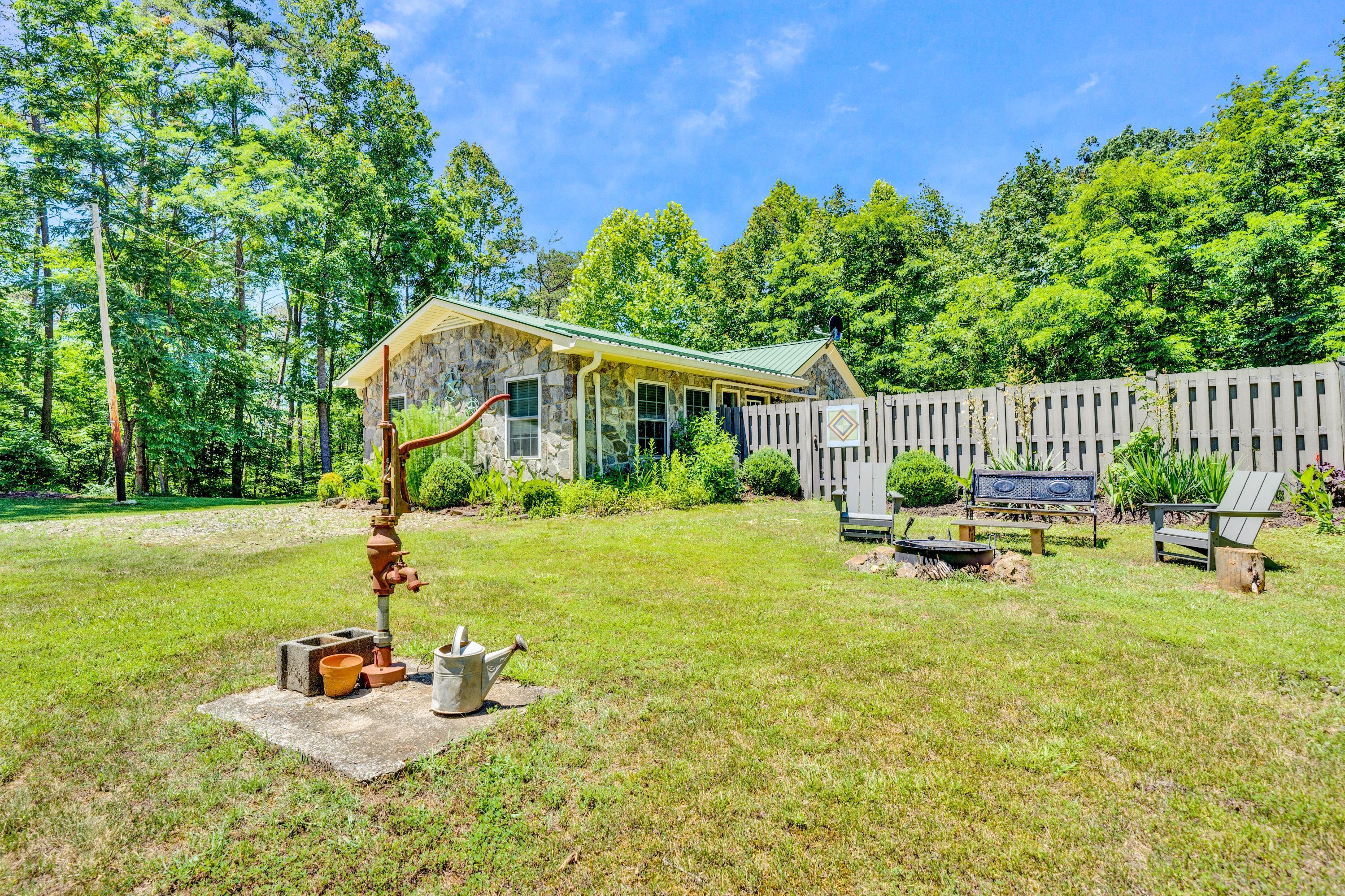 670 Twin Ridge Marina Road Henry, VA 24102 - Photo 26 of 87 a front view of a house with garden and patio