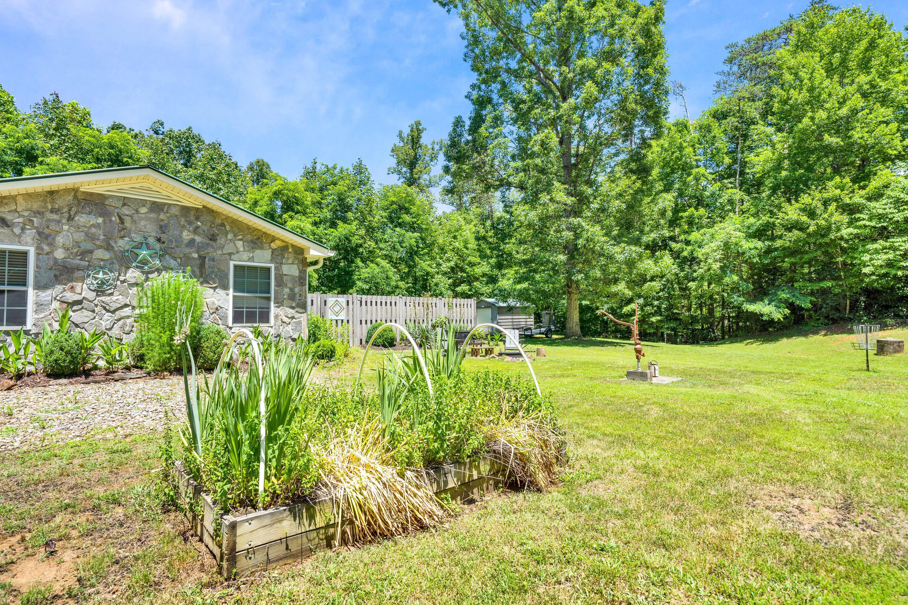 670 Twin Ridge Marina Road Henry, VA 24102 - Photo 27 of 87 a view of a garden with a house