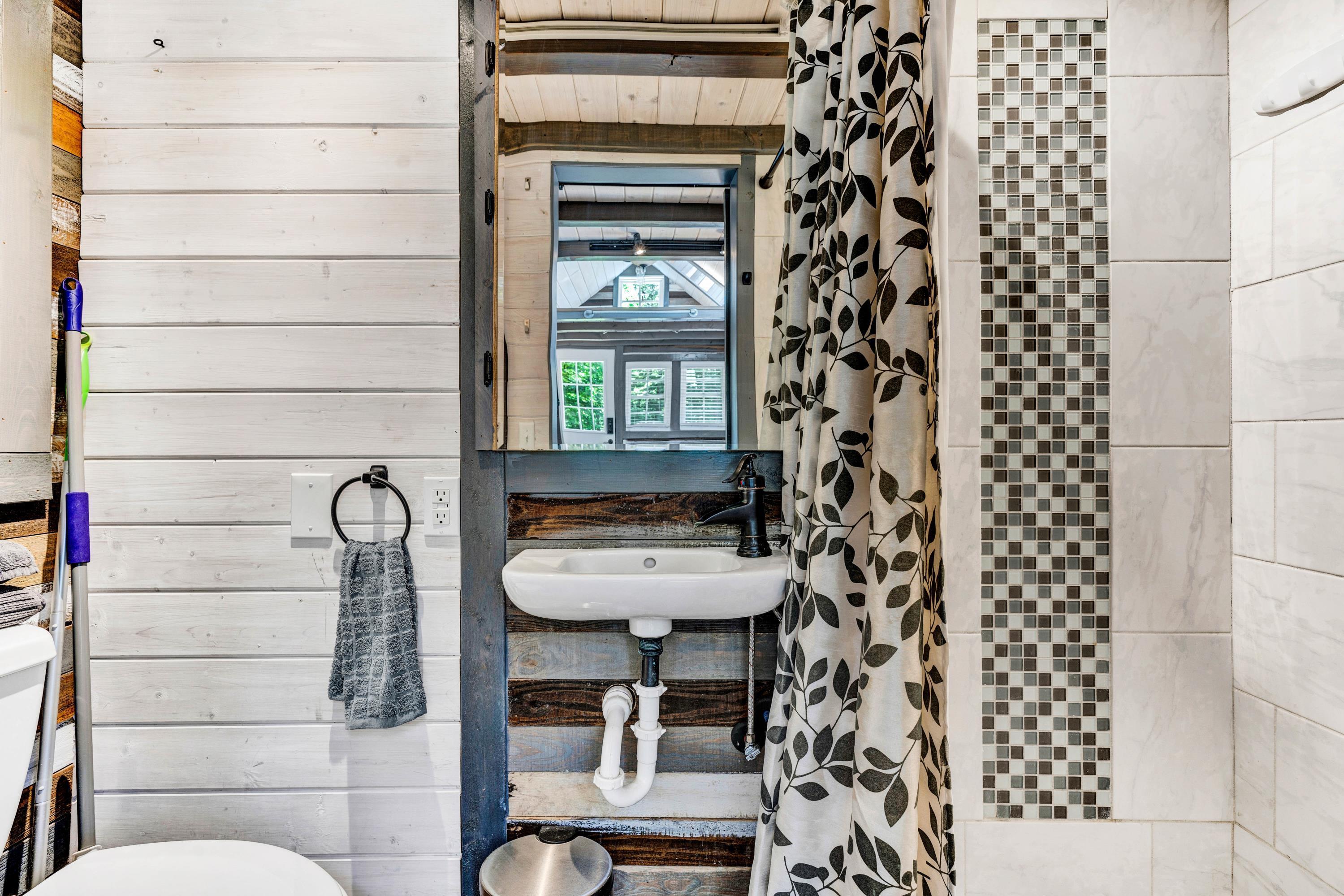 670 Twin Ridge Marina Road Henry, VA 24102 - Photo 42 of 87 a bathroom with a sink toilet and shower