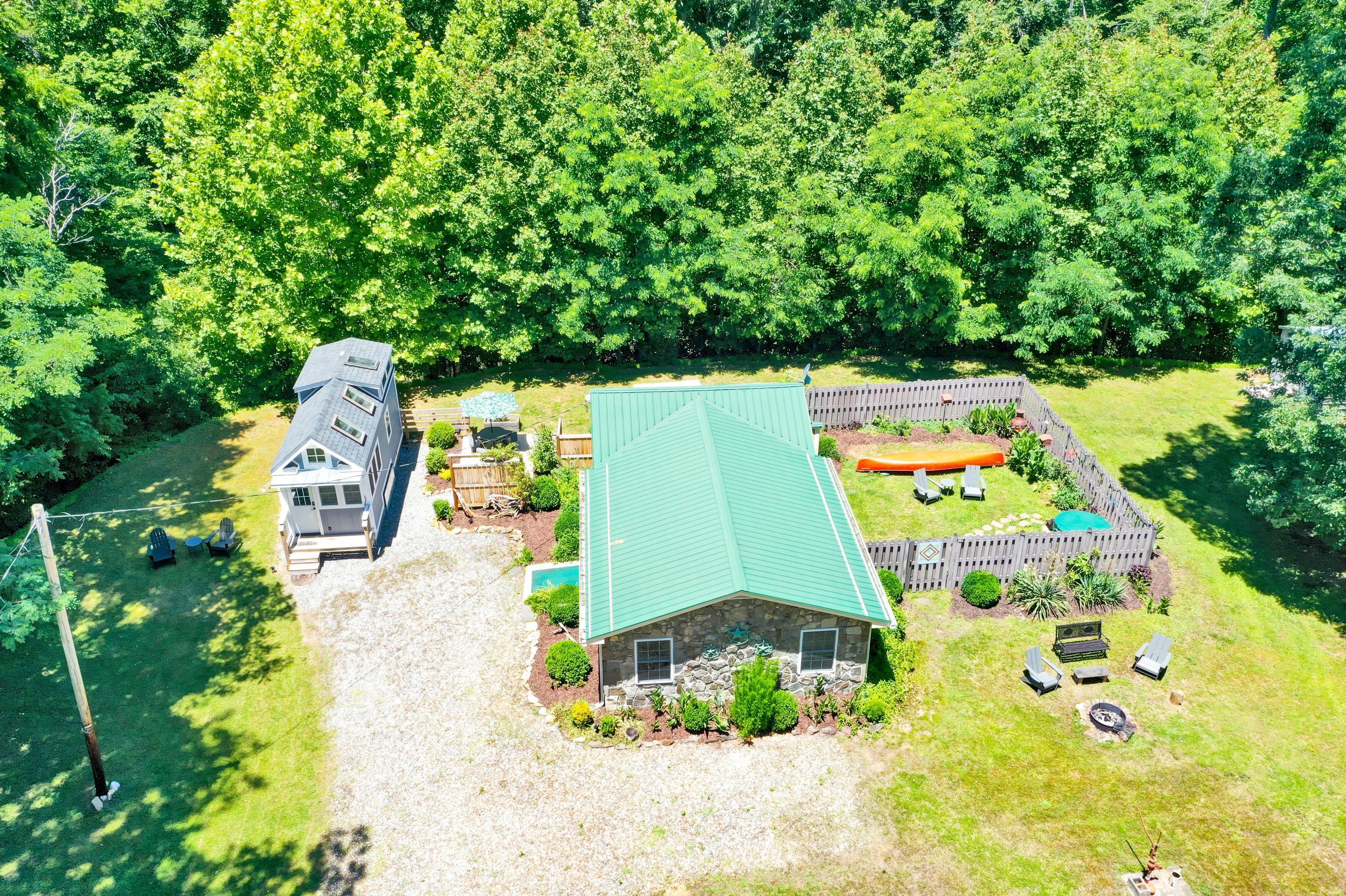 670 Twin Ridge Marina Road Henry, VA 24102 - Photo 49 of 87 an aerial view of a house with a yard and swimming pool