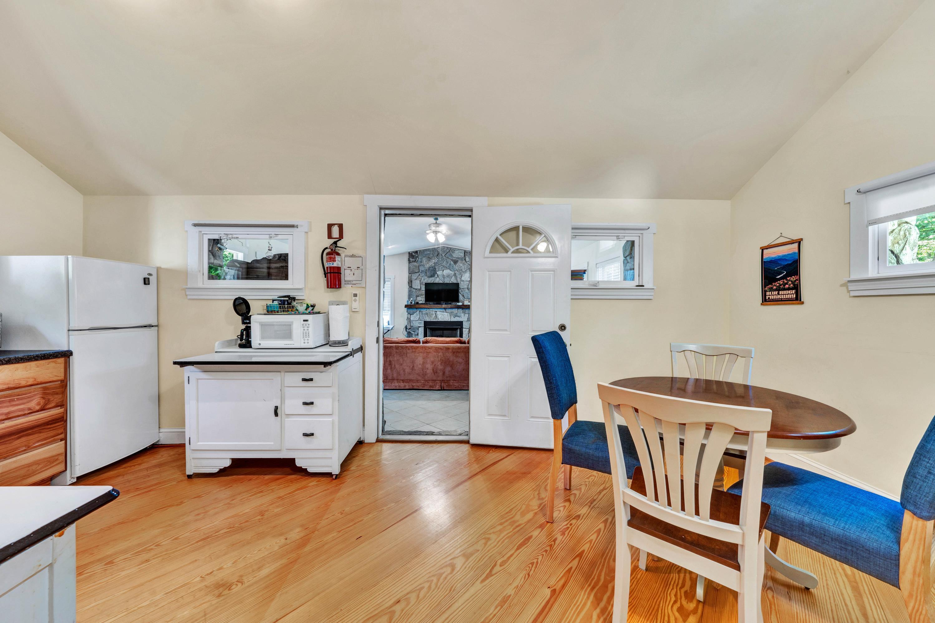 670 Twin Ridge Marina Road Henry, VA 24102 - Photo 10 of 87 a view of a dining room with furniture and wooden floor