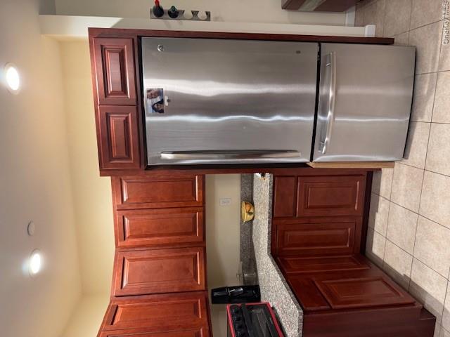 120 East 6th Road Queens, NY 11693 - Photo 5 of 22 a kitchen with stainless steel appliances granite countertop a refrigerator a sink and cabinets