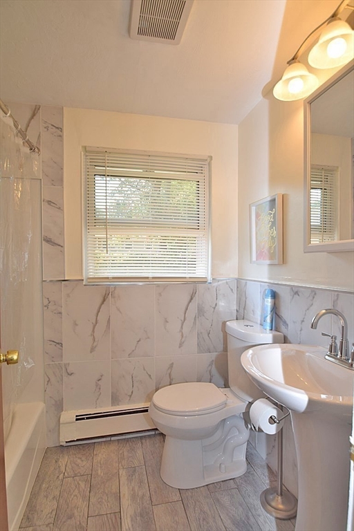 22 Devine Road Randolph, MA 02368 - Photo 15 of 27 a bathroom with a sink a toilet and a bathtub