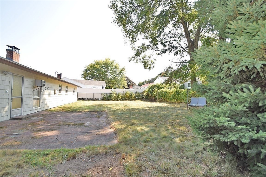 22 Devine Road Randolph, MA 02368 - Photo 23 of 27 a view of back yard of the house