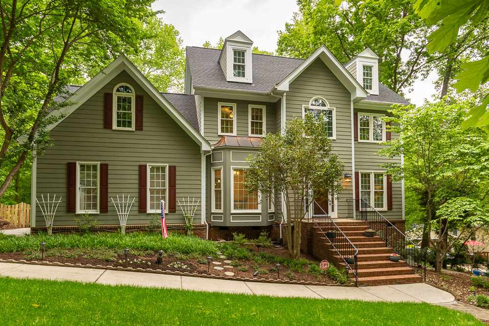 2728 Sunnystone Way Raleigh, NC 27613 - Photo 1 of 30 a front view of a house with a yard
