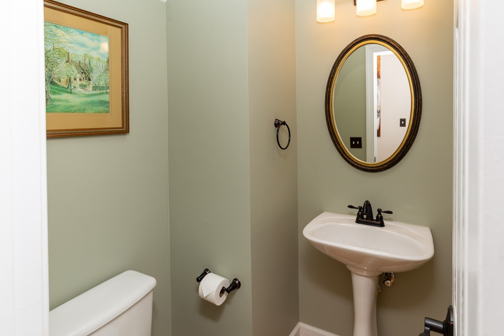 2728 Sunnystone Way Raleigh, NC 27613 - Photo 8 of 30 a bathroom with a sink and a mirror