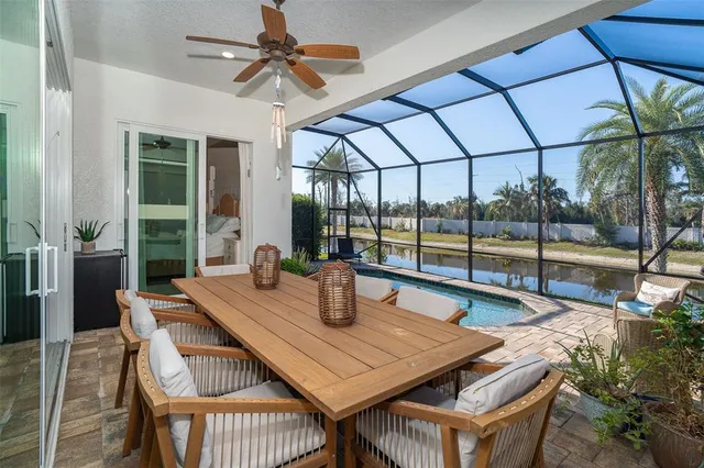 a view of a swimming pool with a patio