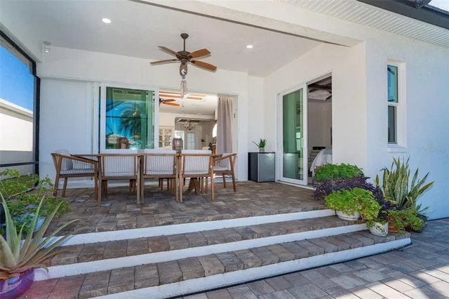 a view of a chairs and table in the patio