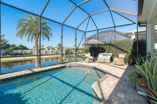 a bedroom with a bed and a dresser with potted plants