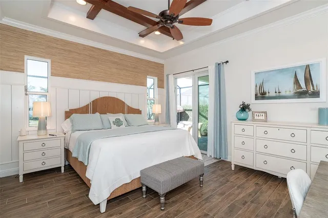 a view of a workspace with furniture and wooden floor