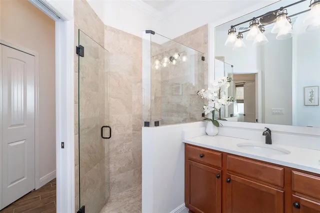 a view of a house with a yard and potted plants