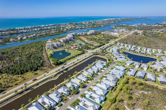 a view of a backyard with sitting area