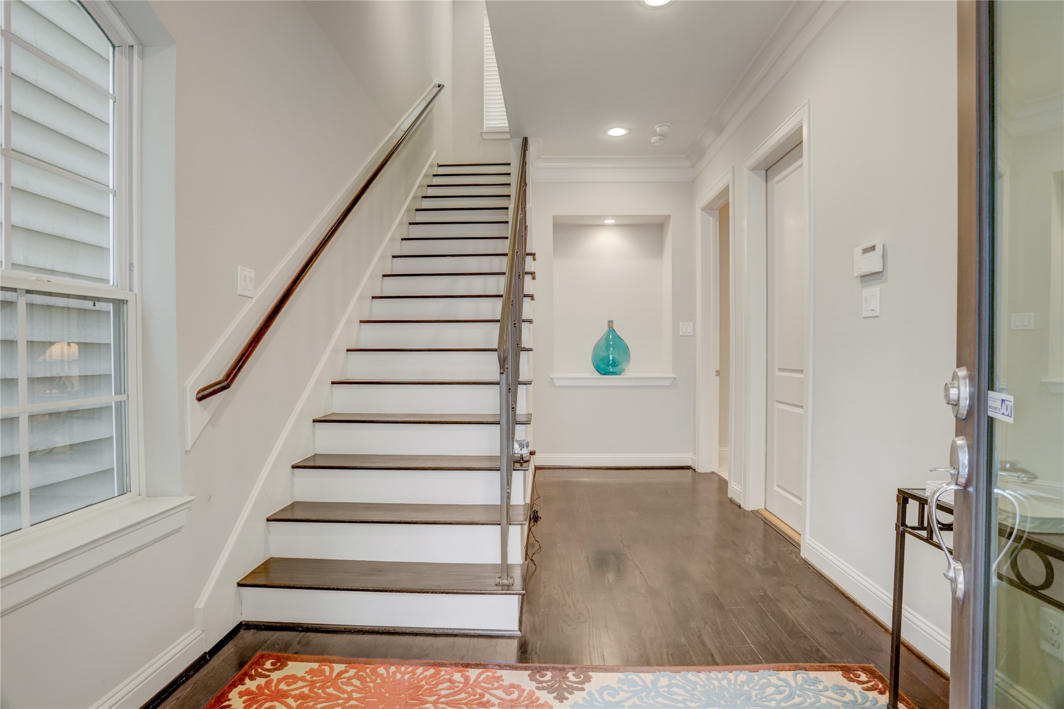 5637 Kiam Street, Unit D Houston, TX 77007 - Photo 2 of 12 a view of entryway and hall with wooden floor
