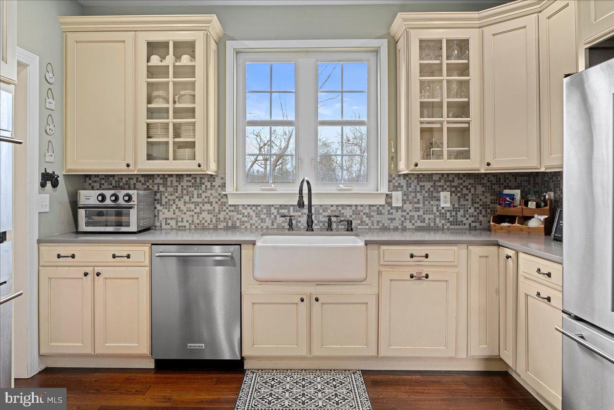 502 East Creamery Road Perkasie, PA 18944 - Photo 12 of 58 a kitchen with stainless steel appliances granite countertop a sink a stove and cabinets