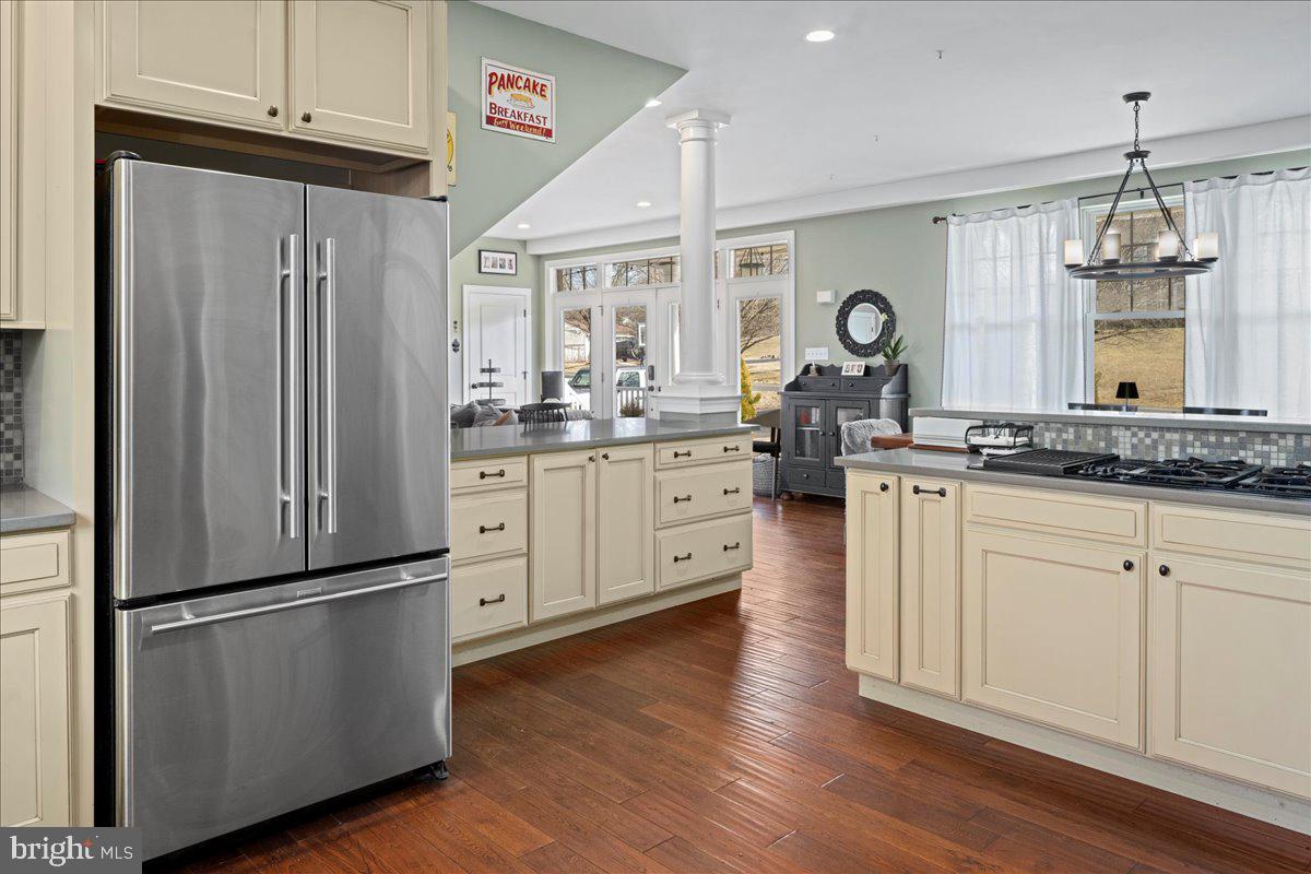 502 East Creamery Road Perkasie, PA 18944 - Photo 13 of 58 a kitchen with stainless steel appliances granite countertop a refrigerator a sink dishwasher a stove and white cabinets with wooden floor