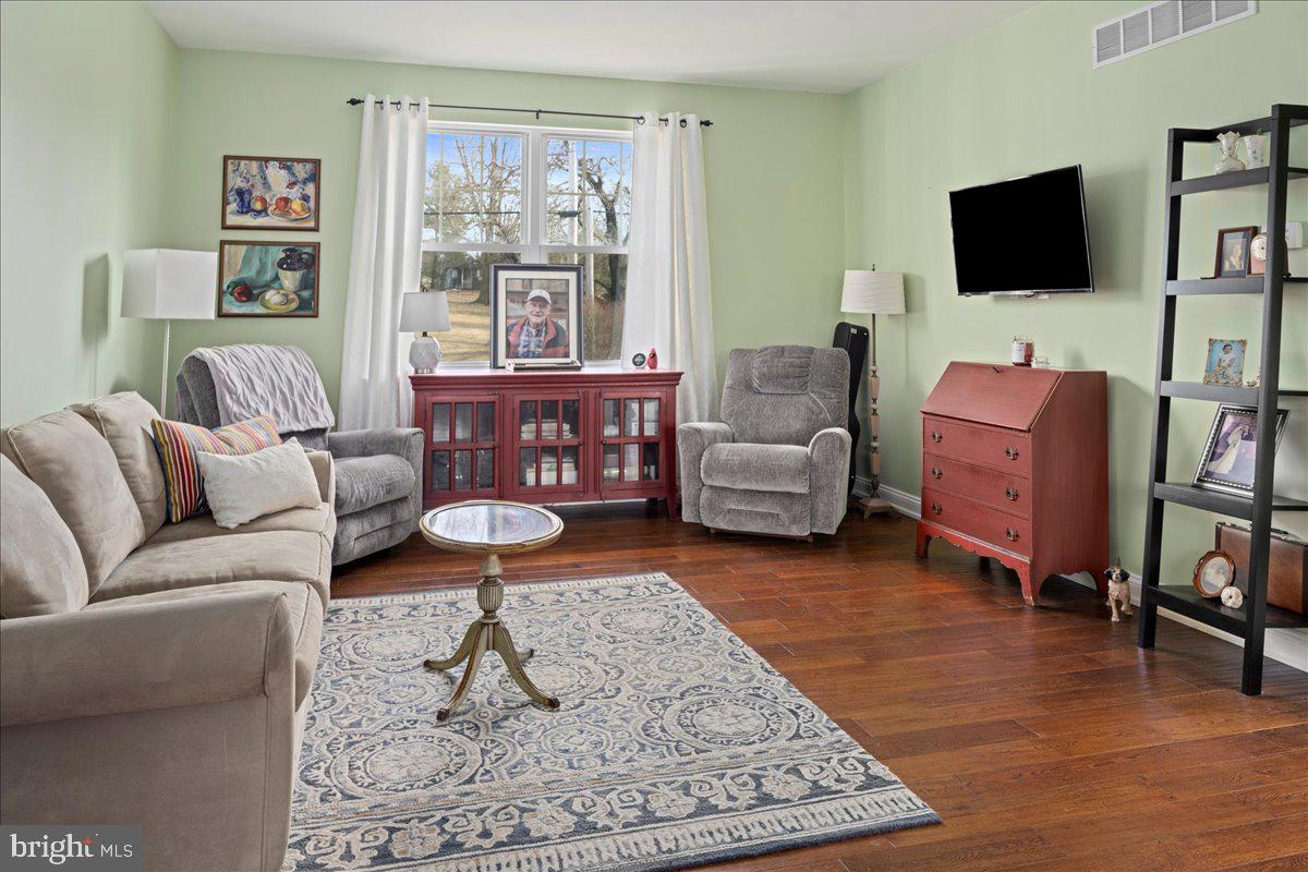 502 East Creamery Road Perkasie, PA 18944 - Photo 18 of 58 a living room with furniture and a flat screen tv