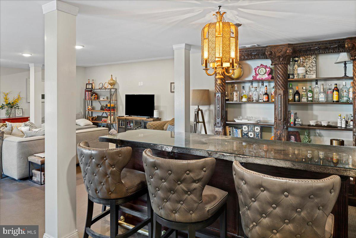 502 East Creamery Road Perkasie, PA 18944 - Photo 42 of 58 a kitchen with stainless steel appliances granite countertop a table chairs and a refrigerator