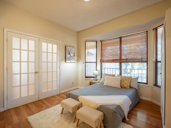 a bedroom with a bed and window