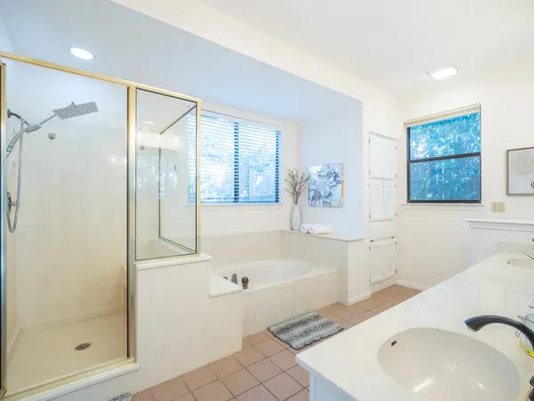 a bathroom with a bathtub and a shower