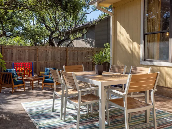 a view of chairs and tables in the patio
