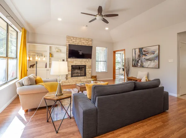 a living room with furniture and a flat screen tv