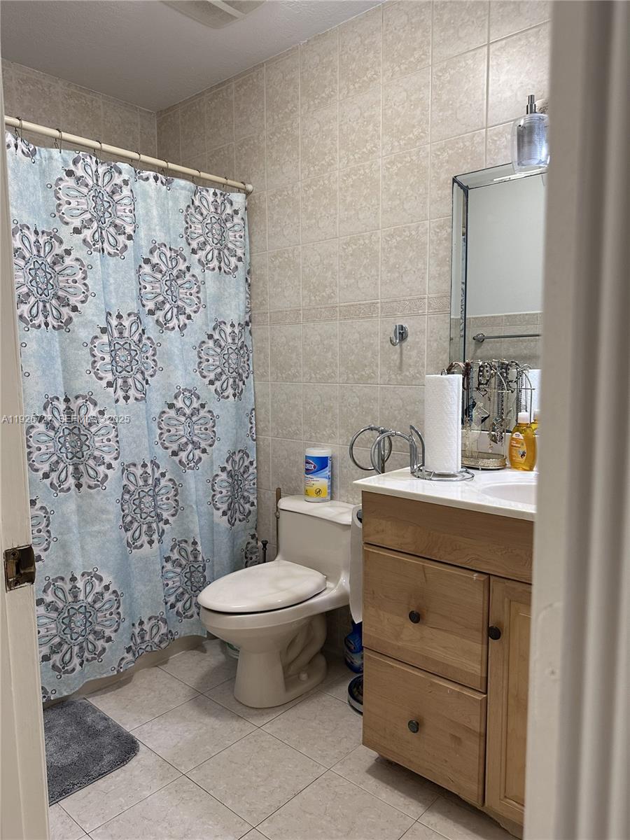 165 Southwest 130th Avenue Miami, FL 33182 - Photo 13 of 20 a bathroom with a sink toilet and shower