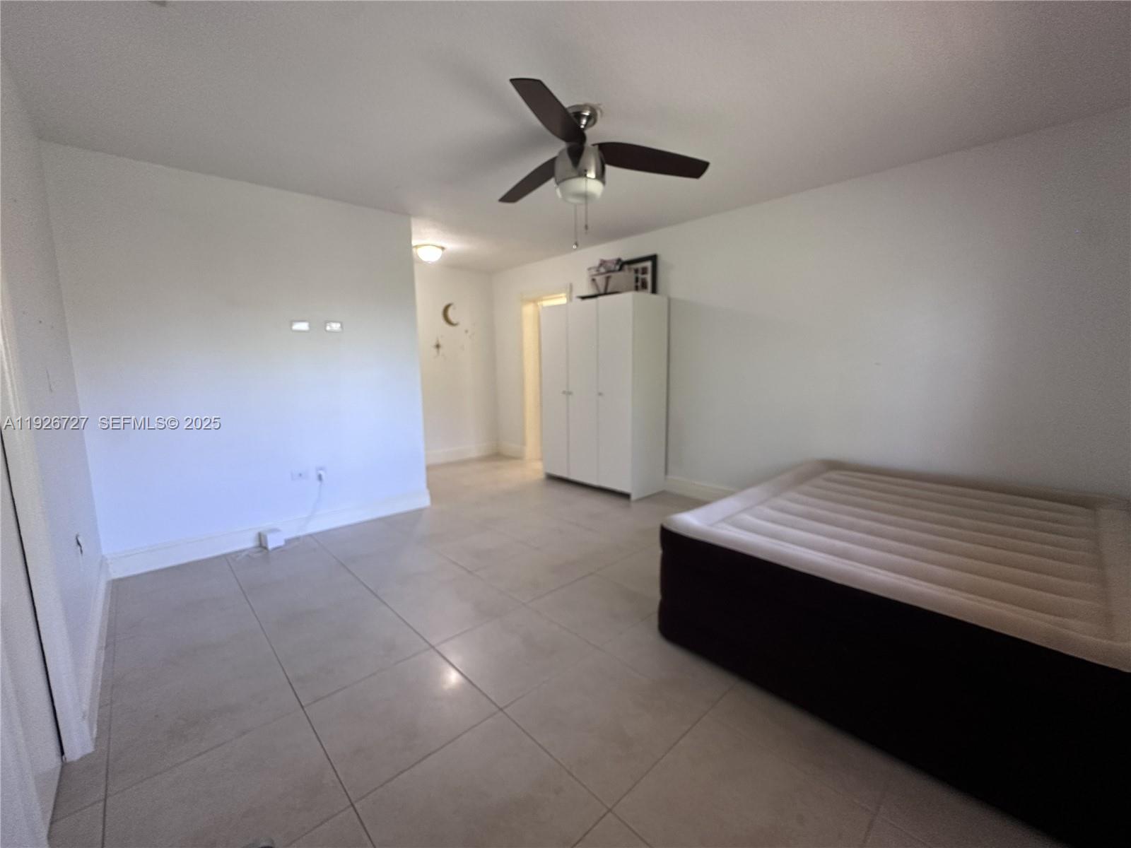 165 Southwest 130th Avenue Miami, FL 33182 - Photo 14 of 20 a room with a ceiling fan and a ceiling fan
