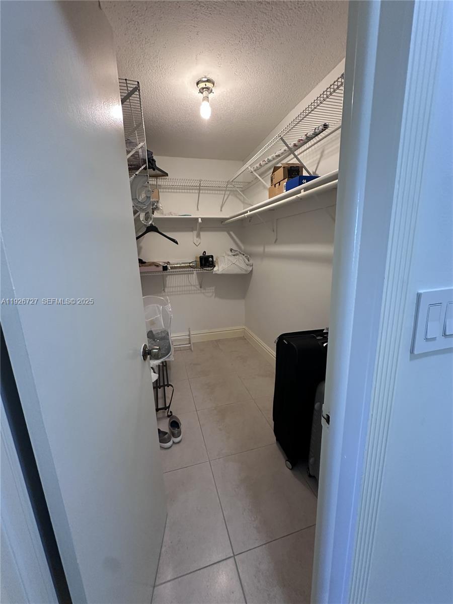 165 Southwest 130th Avenue Miami, FL 33182 - Photo 15 of 20 a view of walk in closet