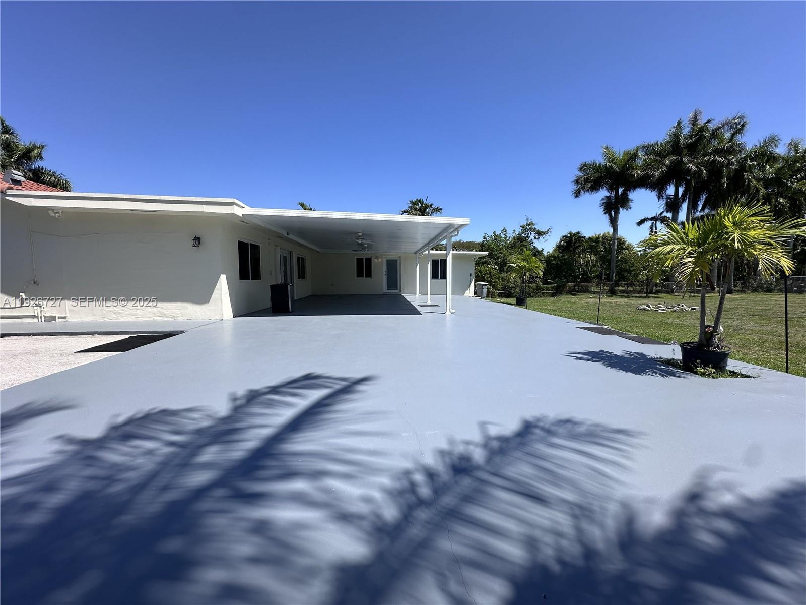 165 Southwest 130th Avenue Miami, FL 33182 - Photo 20 of 20 a view of a house with a patio