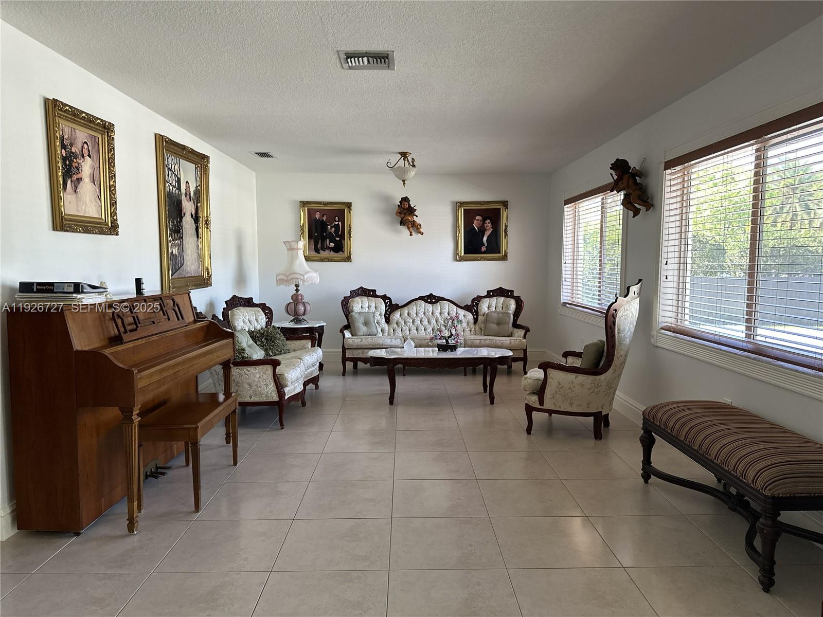 165 Southwest 130th Avenue Miami, FL 33182 - Photo 4 of 20 a living room with furniture and a large window