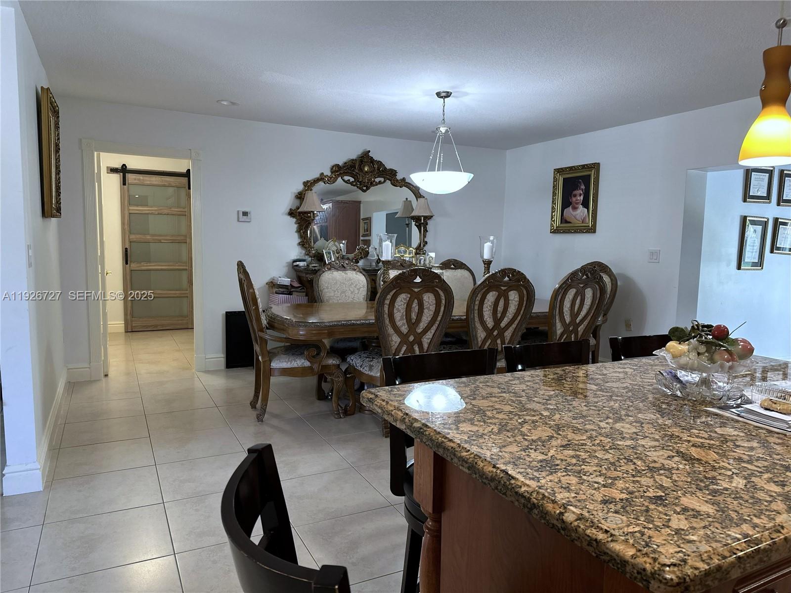 165 Southwest 130th Avenue Miami, FL 33182 - Photo 5 of 20 a view of a dining room with furniture