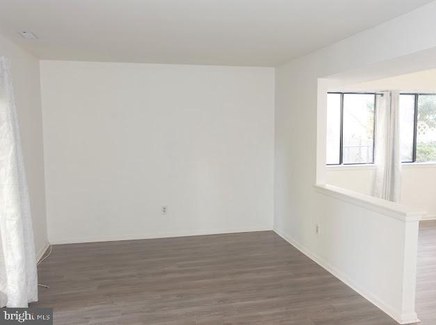 5 Christopher Road Voorhees, NJ 08043 - Photo 12 of 31 a view of an empty room with wooden floor and a window