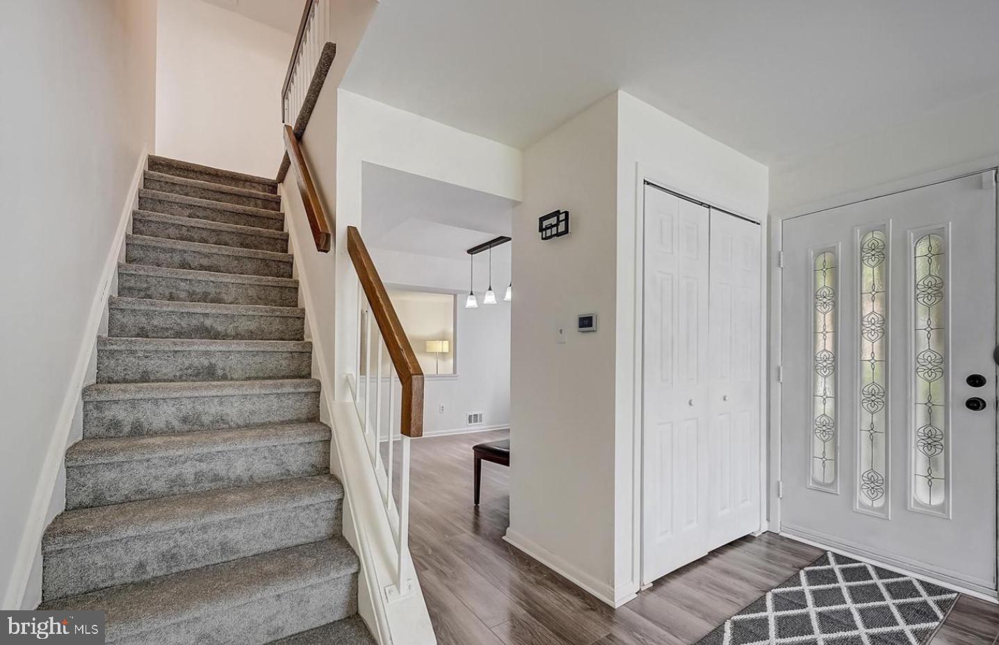 5 Christopher Road Voorhees, NJ 08043 - Photo 17 of 31 a view of entryway with stairs and wooden floor