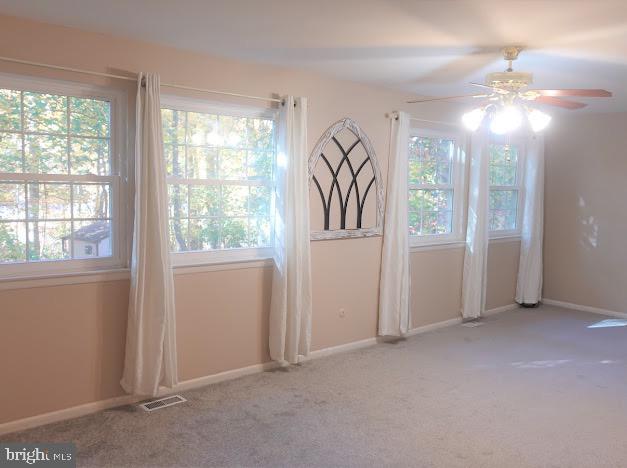 5 Christopher Road Voorhees, NJ 08043 - Photo 21 of 31 an empty room with windows and chandelier