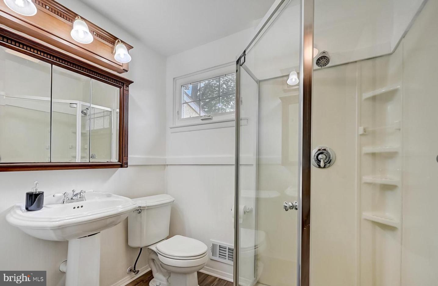 5 Christopher Road Voorhees, NJ 08043 - Photo 23 of 31 a bathroom with a sink a toilet and shower