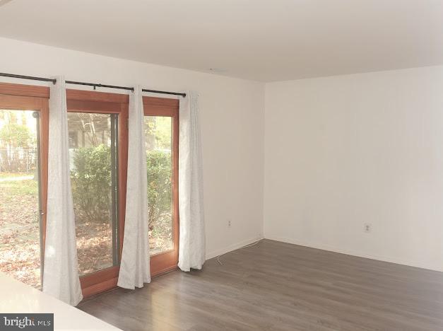 5 Christopher Road Voorhees, NJ 08043 - Photo 9 of 31 a view of an empty room with wooden floor and a window