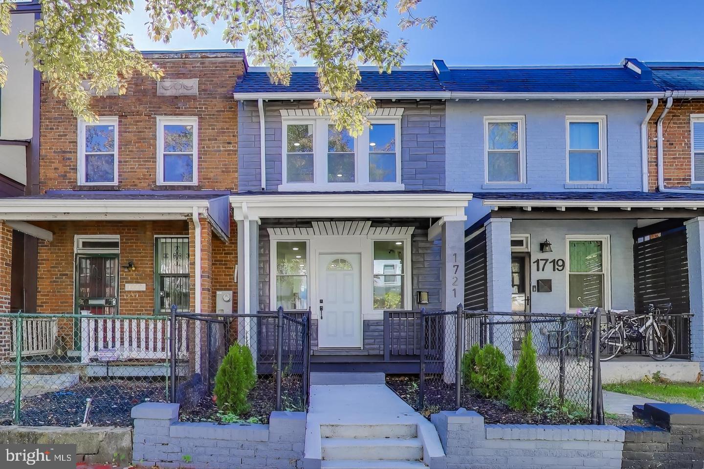 1721 L Street Northeast Washington, DC 20002 - Photo 1 of 32 front view of a brick house with a small yard