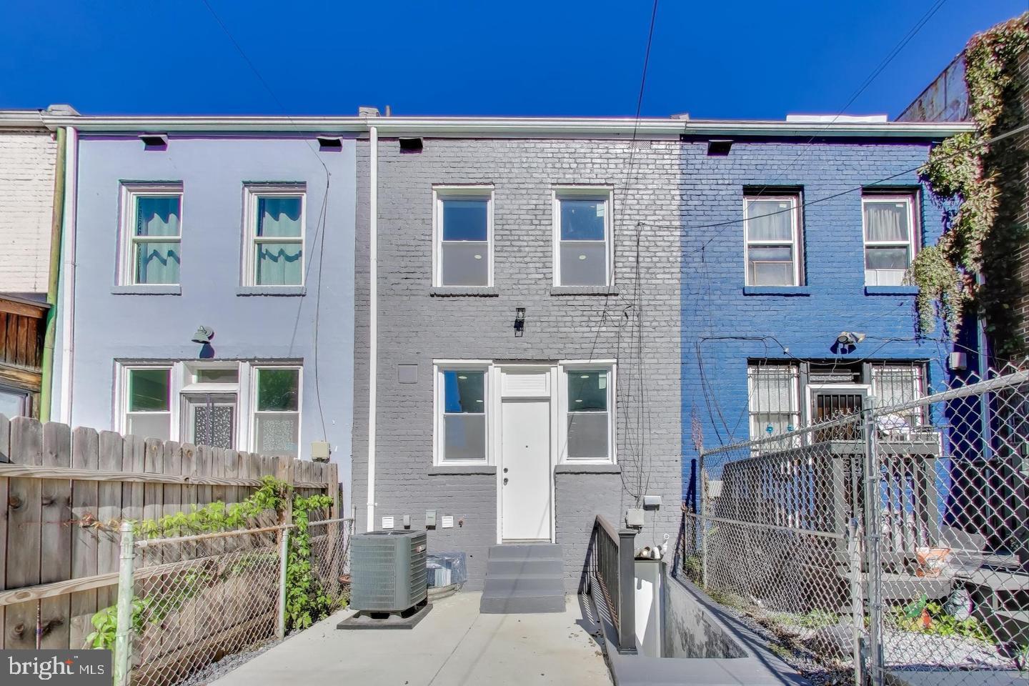 1721 L Street Northeast Washington, DC 20002 - Photo 29 of 32 a view of a brick wall next to a yard